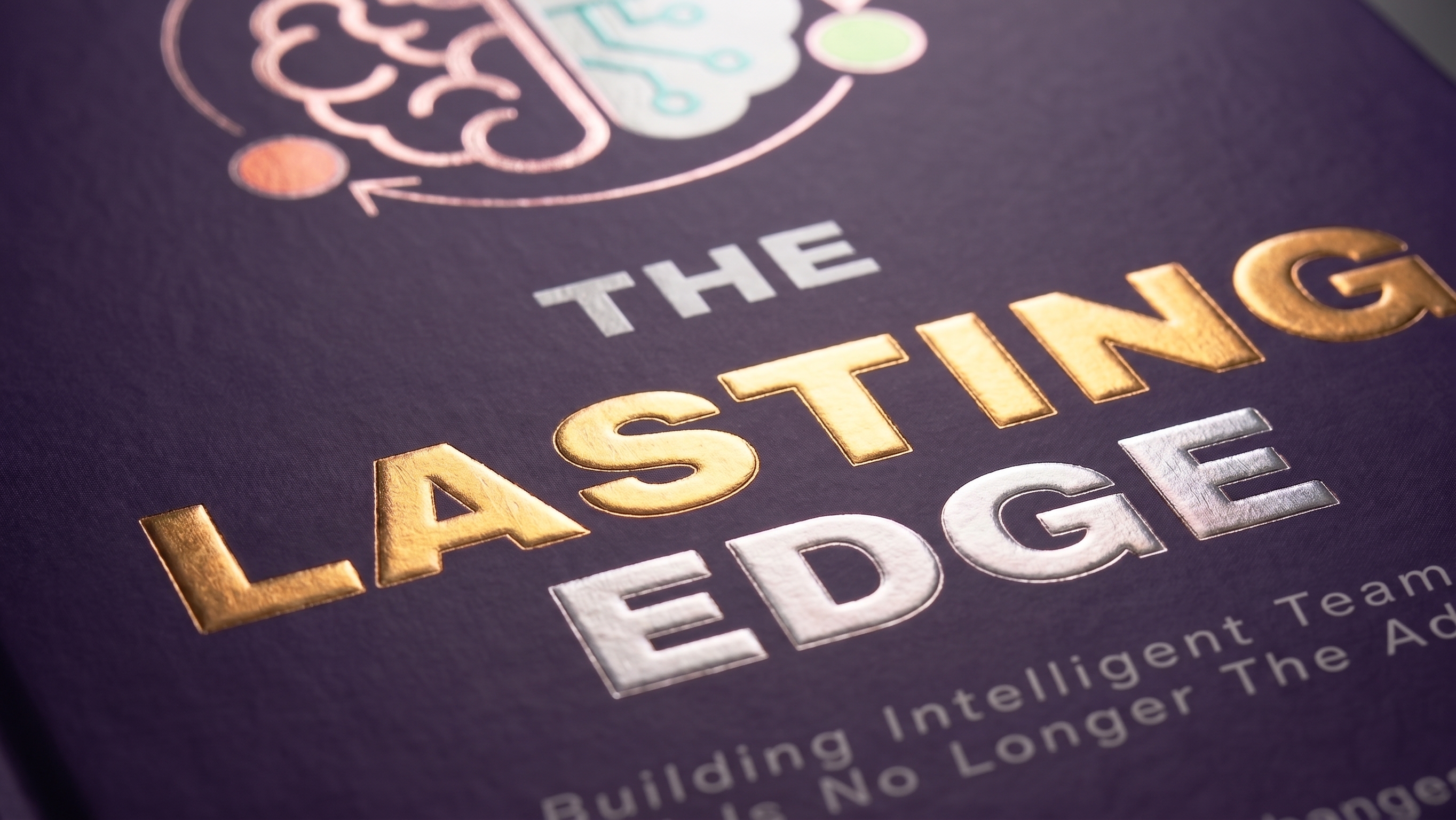 Detail view of gold and silver foil stamped lettering on The Lasting Edge cover